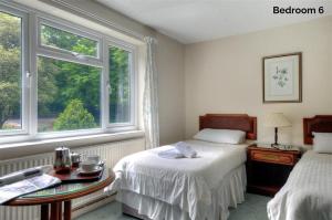 Tempat tidur dalam kamar di The Orchard Country House