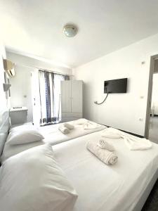 Postel nebo postele na pokoji v ubytování Atrium Apartment #1