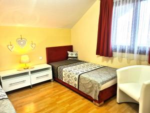 Кровать или кровати в номере Apartment Loindl