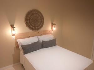 Cama ou camas em um quarto em Pousada Mareia
