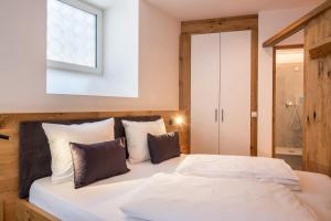 Postel nebo postele na pokoji v ubytování Luisl Hof - Apartment Herbae
