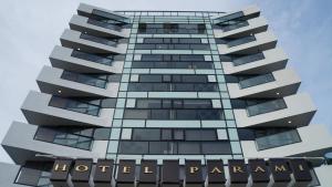 a tall building with a hotel patagonia sign on it at Hotel Parami in Yangon
