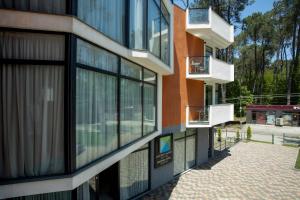 a building with balconies on the side of it at Graphica Black Sea in Shekhvetili