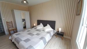 Posteľ alebo postele v izbe v ubytovaní LES FLOTS BLEUS - Appartement 2 chambres vue mer