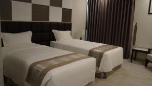 A bed or beds in a room at Hotel Parami