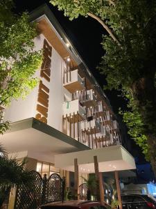 a building with a lot of balconies on it at night at Hotel Saint Tropez in Riccione