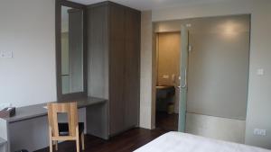 A bed or beds in a room at Hotel Parami