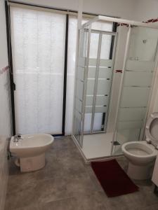 a bathroom with a toilet and a sink at Chajofe 8 in Los Cristianos +53 photos