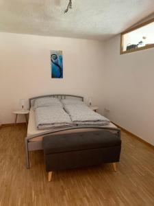 a bedroom with a bed in a room at Ferienwohnung Hundertwasser in Marktheidenfeld am Main in Marktheidenfeld