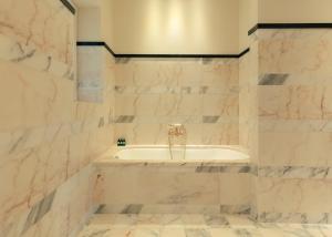 a bathroom with a tub and a sink at Hotel la Ponche in Saint-Tropez