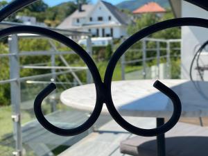 a close up of a metal railing on a balcony at Le clos des Pommiers in Uffholtz