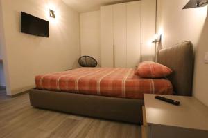 Säng eller sängar i ett rum på A Casa di Febe - a Pisogne sul lago d'Iseo