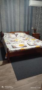 a bed sitting in a room with at Guest House Sunrise in Shabla