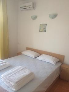 Postel nebo postele na pokoji v ubytování Guest Rooms Venera