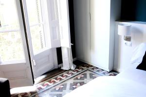 Posteľ alebo postele v izbe v ubytovaní Close to Passeig de Gracia