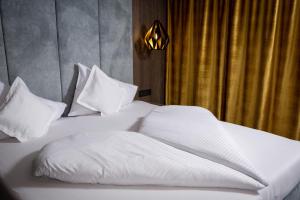 Posteľ alebo postele v izbe v ubytovaní Hotel Das Kohlmais