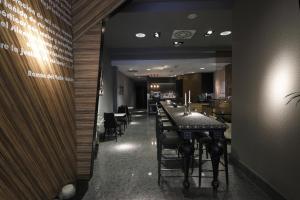 a dining room with a long table and chairs at Capitol Boutique Hotel in Santiago de Compostela
