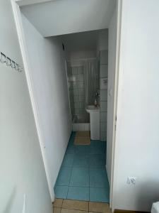 a bathroom with a shower and a toilet and a sink at Pokoje Gościnne Juliusz in Mielno