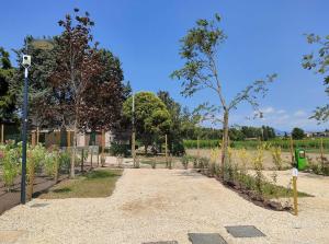 A garden outside Garda Di Vino Agricamping & Wine Shop Lazise