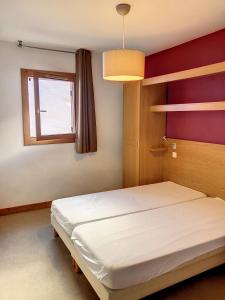 Posteľ alebo postele v izbe v ubytovaní Appartement station Sainte Foy Tarentaise