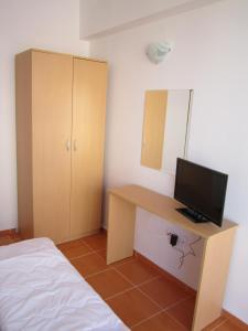 TV a/nebo společenská místnost v ubytování Guest Rooms Venera