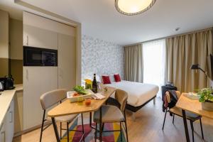 TV a/nebo společenská místnost v ubytování Aparthotel Adagio Zurich City Center