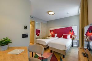 Postel nebo postele na pokoji v ubytování Aparthotel Adagio Zurich City Center + 37 fotografií