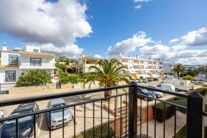 a view from a balcony of a parking lot at Baía da Luz - Sea View Luxury Apartment in Luz