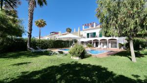 a house with a swimming pool in a yard at Vila Castro-Cleverdetails, Quiet area, private pool in Vilamoura