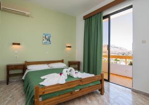Postel nebo postele na pokoji v ubytování Hotel Eleni Anagros + 15 fotografií