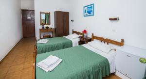Postel nebo postele na pokoji v ubytování Hotel Eleni Anagros