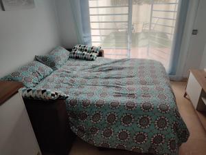 Łóżko lub łóżka w pokoju w obiekcie Apartamento Los Patos Beach