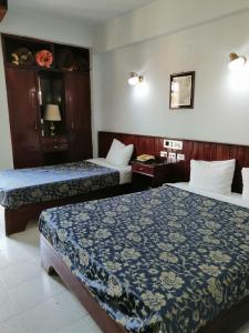 Postel nebo postele na pokoji v ubytování Windsor Hotel Luxor