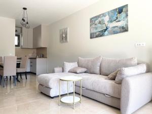 a living room with a couch and a table at Villa Pul in Risan