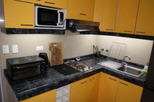 Kuchyň nebo kuchyňský kout v ubytování Cabañas Habitainer BordeRio