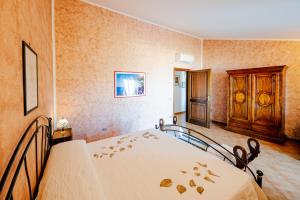 Ένα ή περισσότερα κρεβάτια σε δωμάτιο στο Appartamento Ilaria in Villa Laura +14 φωτογραφίες