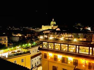 a view of a city at night with a building at Prati di Borgo in Rome