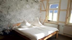 Кровать или кровати в номере Altstadt Pension Orchidee
