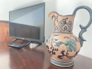 TV a/nebo společenská místnost v ubytování Hotel Al-Andalus