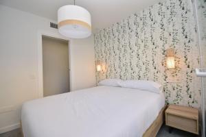 Posteľ alebo postele v izbe v ubytovaní Apartamento Emperatriz