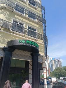 a building with a sign that reads de moco restaurant at Dê MOCCIS Boutique Hotel in Kuala Lumpur