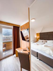 Postel nebo postele na pokoji v ubytování Sylpaulerhof Aparthotel + 37 fotografií