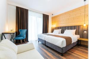 Letto o letti in una camera di Hotel Chatini Mestia