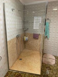a shower with a glass door in a bathroom at Casa rural, Mas de Joan i Cinta in Sant Jaume d'Enveja +26 photos