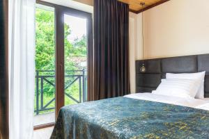 Letto o letti in una camera di Hotel Chatini Mestia