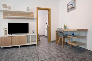 TV a/nebo společenská místnost v ubytování Casa Relax