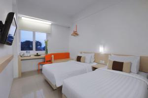 Postel nebo postele na pokoji v ubytování Algoritma Hotel