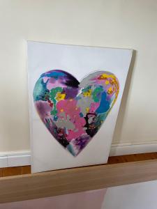 a painting of a heart on a white canvas at Le cocon jaune - Studio en hyper centre in Lamballe