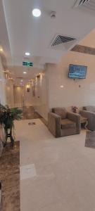 a living room with couches in a large room at فندق ربوة الصفوة 8 - Rabwah Al Safwa Hotel 8 in Al Madinah