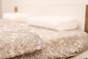 a close up of two beds in a room at Chain Bridge City Center Dorothea in Budapest